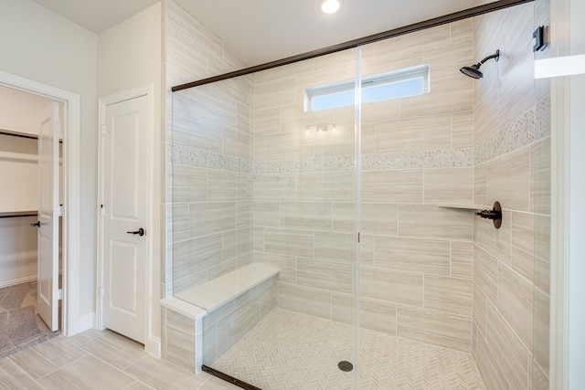 bathroom with a shower with shower door