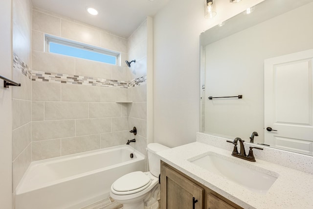 bathroom featuring toilet, shower / bath combination, vanity, and recessed lighting