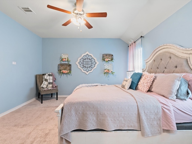 carpeted bedroom featuring ceiling fan and vaulted ceiling