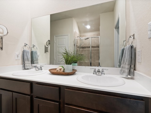 bathroom featuring vanity and an enclosed shower