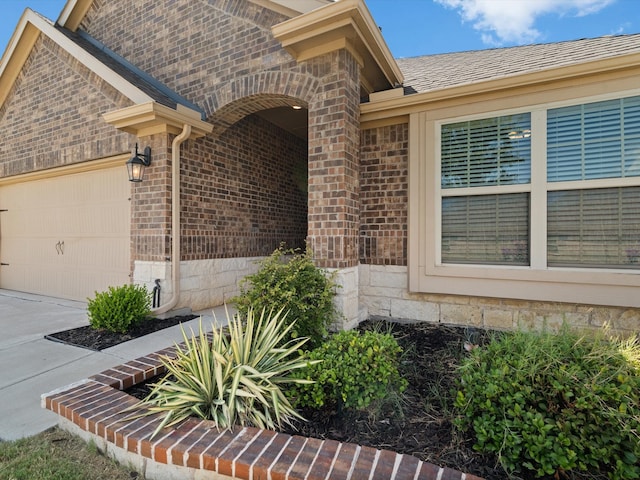 doorway to property featuring a garage