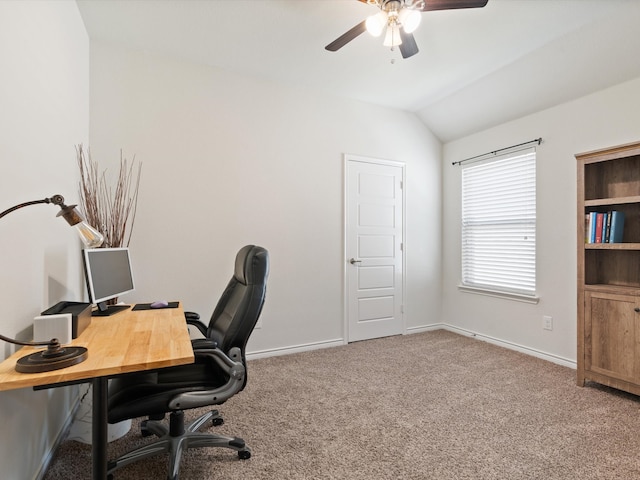 office space featuring carpet, ceiling fan, and vaulted ceiling