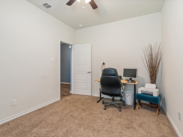 office with carpet flooring and ceiling fan