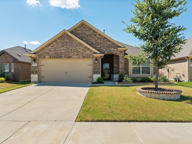 view of front of house with a garage and a front lawn