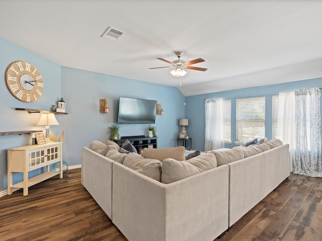 living room with dark hardwood / wood-style floors, vaulted ceiling, and ceiling fan