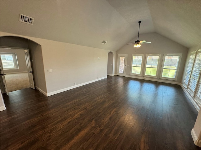 unfurnished living room with ceiling fan, dark wood-type flooring, and lofted ceiling