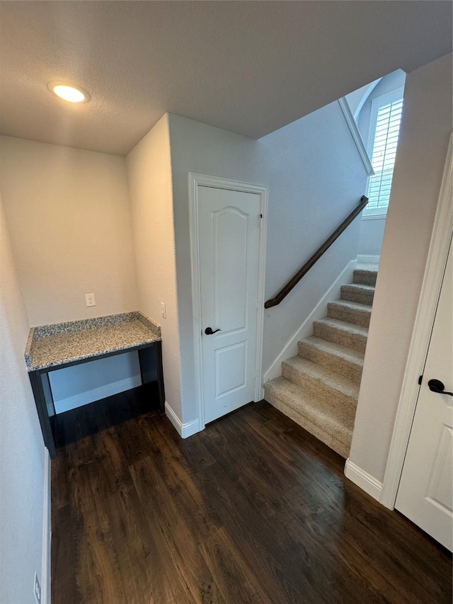 staircase featuring hardwood / wood-style floors