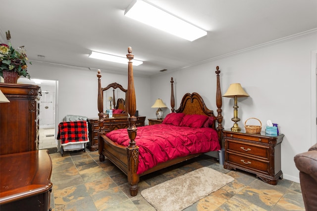 bedroom featuring dark tile patterned floors and ornamental molding