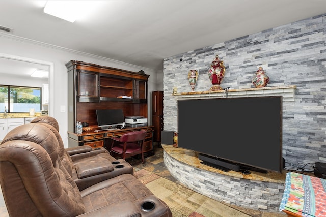 tiled living room featuring a fireplace and crown molding