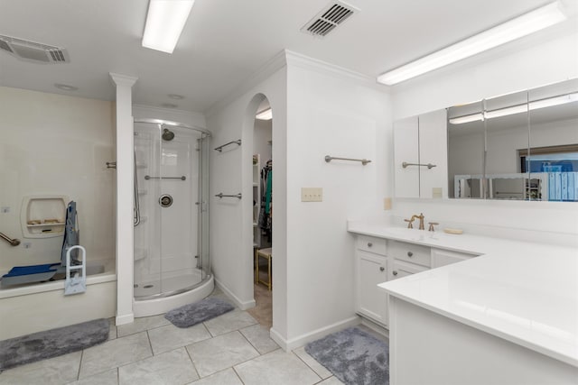 bathroom with tile patterned flooring, a shower with door, crown molding, and vanity