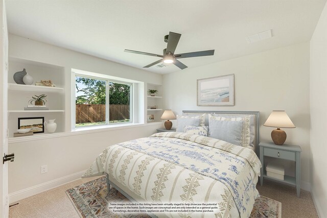 bedroom featuring ceiling fan and carpet