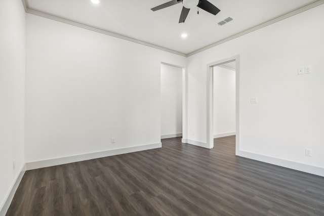 empty room with ornamental molding, dark wood-type flooring, and ceiling fan