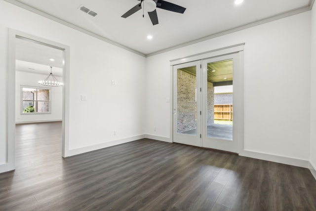 spare room with dark hardwood / wood-style flooring, crown molding, and ceiling fan with notable chandelier