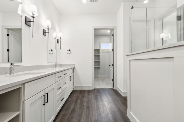 bathroom featuring hardwood / wood-style flooring and vanity