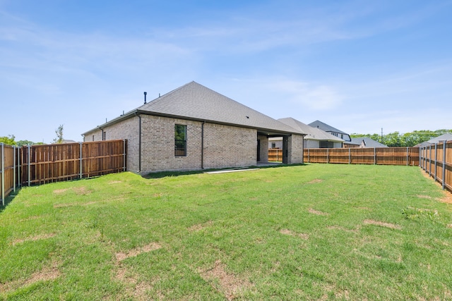 rear view of house with a yard