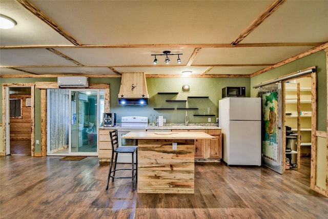 kitchen with extractor fan, white appliances, dark hardwood / wood-style flooring, a breakfast bar, and a center island