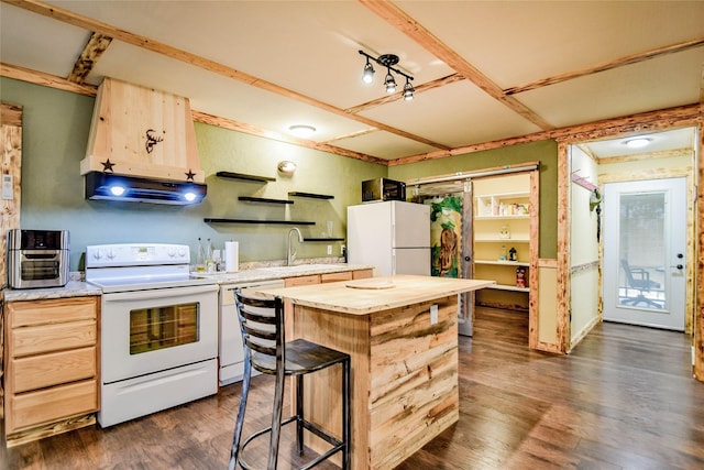 kitchen with dark hardwood / wood-style floors, range hood, a center island, white appliances, and light brown cabinetry