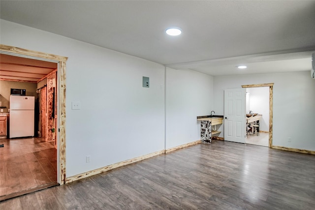 empty room featuring dark hardwood / wood-style flooring