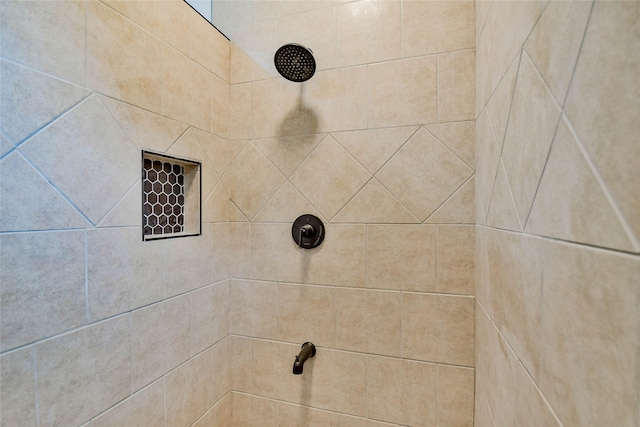 room details featuring a tile shower