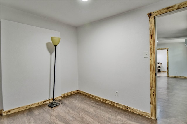 empty room with wood-type flooring