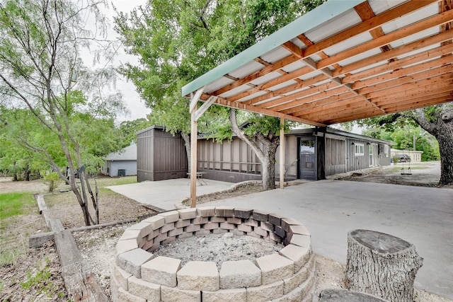 view of patio / terrace with an outdoor fire pit