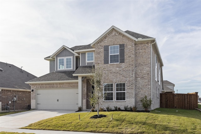 view of front of house with a front yard and a garage