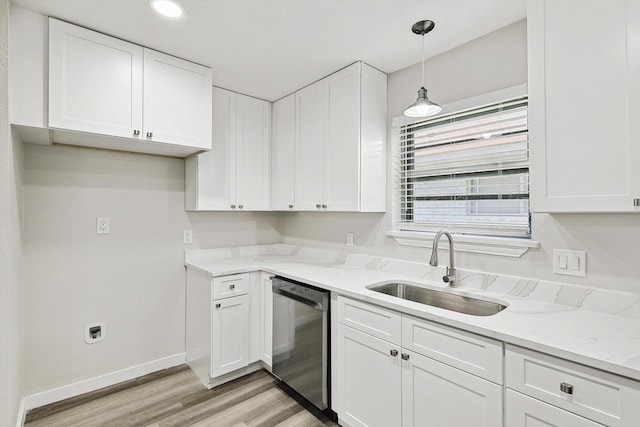 kitchen with light stone countertops, stainless steel dishwasher, hanging light fixtures, white cabinets, and sink