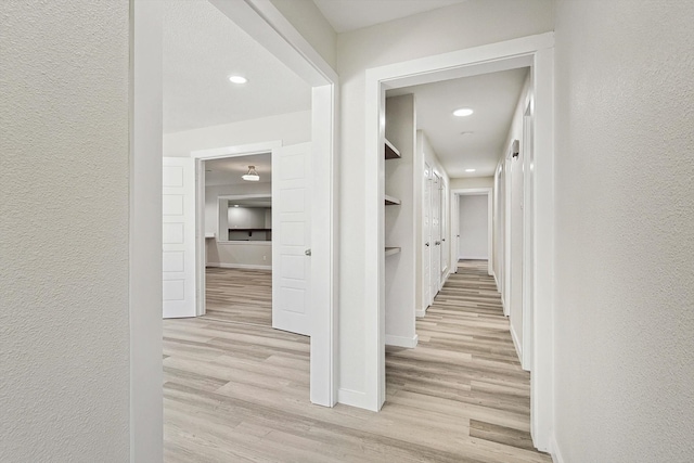 hall with light wood-type flooring