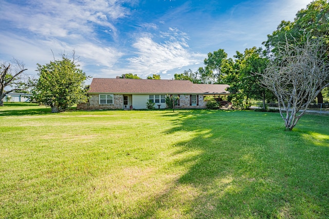 single story home with a front yard