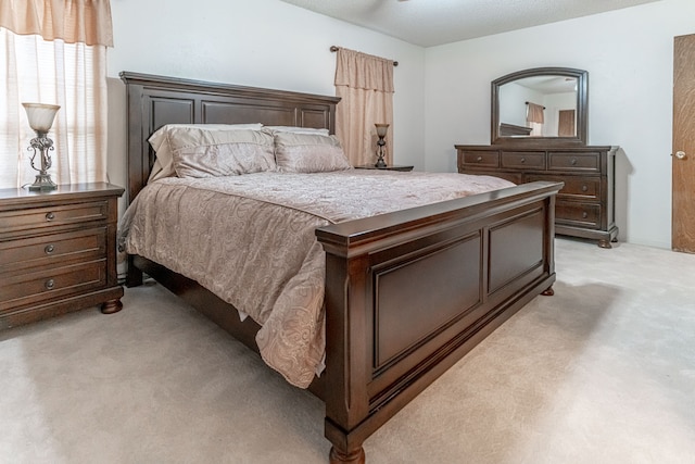 bedroom featuring light carpet