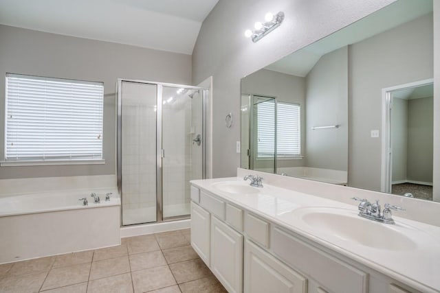 bathroom featuring tile patterned floors, vanity, independent shower and bath, and lofted ceiling