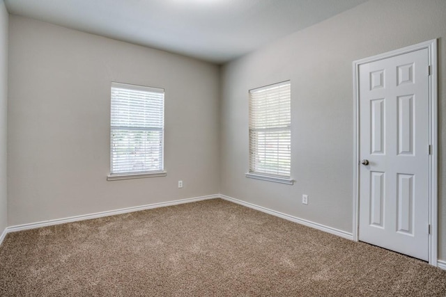 unfurnished room with carpet flooring