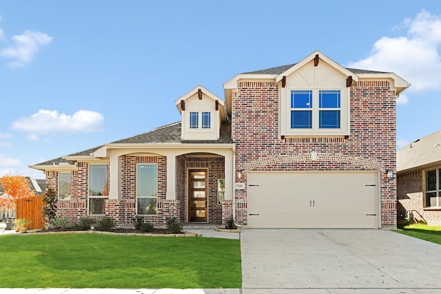 view of front facade with a garage and a front lawn