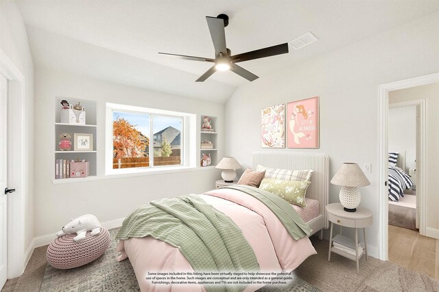 bedroom featuring hardwood / wood-style floors, ceiling fan, and lofted ceiling