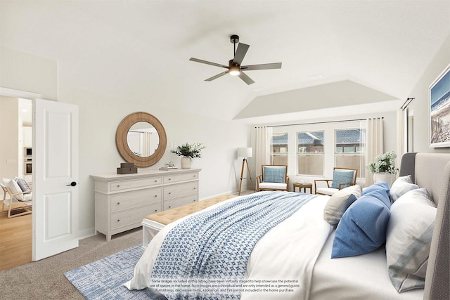 bedroom with ceiling fan, light carpet, and lofted ceiling