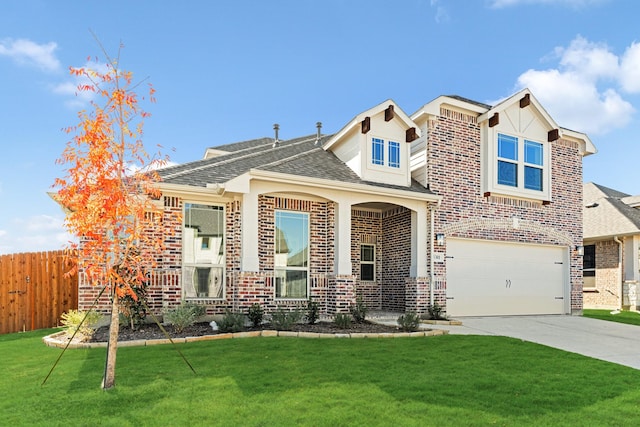 view of front of property with a garage and a front lawn