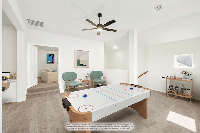 playroom with light colored carpet and ceiling fan