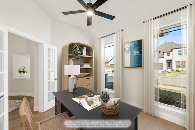 office area with ceiling fan, light wood-type flooring, and lofted ceiling