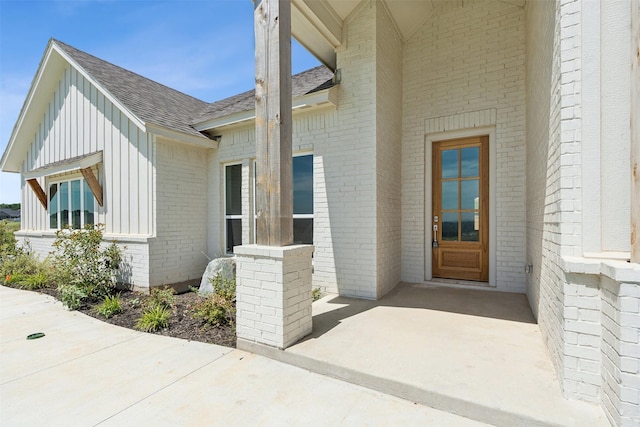 entrance to property featuring a patio