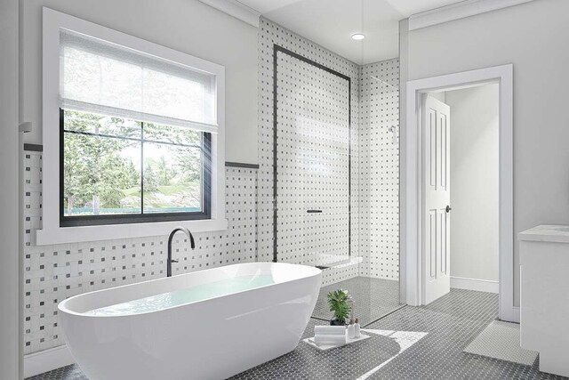 bathroom with tile patterned flooring, tile walls, and a bath