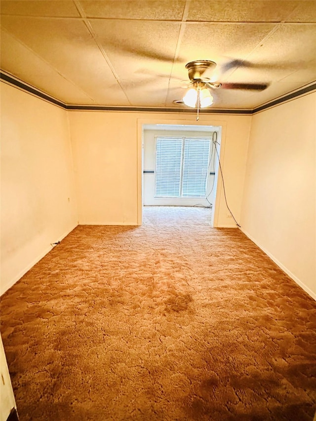 empty room with a textured ceiling, carpet floors, and ceiling fan