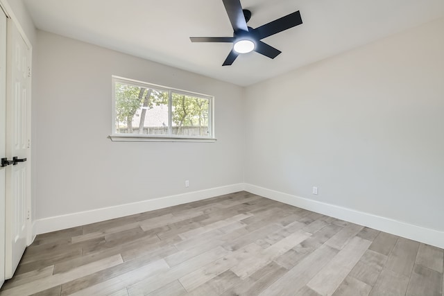 unfurnished room featuring ceiling fan and light wood-type flooring