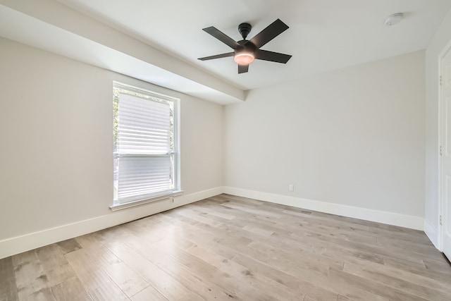 spare room with ceiling fan and light hardwood / wood-style flooring