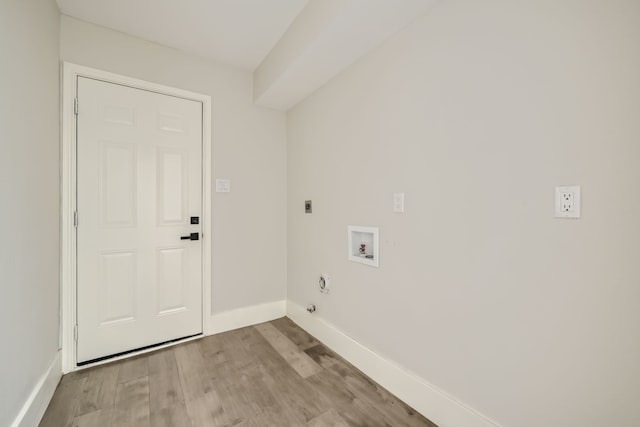 laundry area with hookup for an electric dryer, washer hookup, and light hardwood / wood-style floors