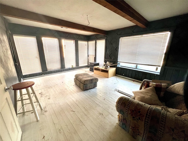 sunroom with beam ceiling