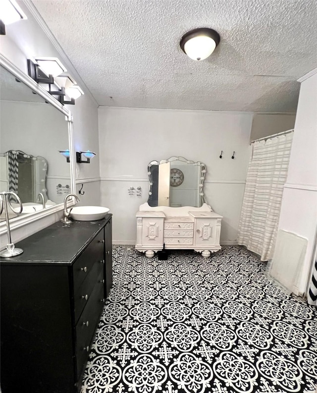 bathroom featuring vanity and a textured ceiling