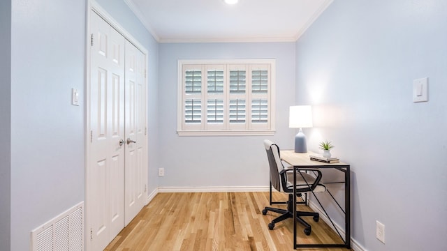 office space with crown molding and light hardwood / wood-style flooring