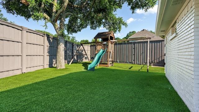 view of yard with a playground