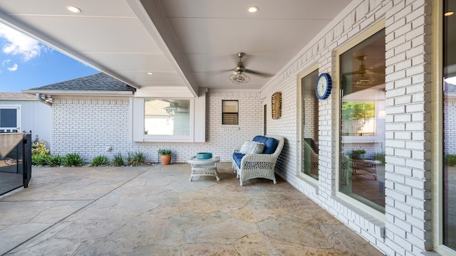 view of patio / terrace featuring ceiling fan