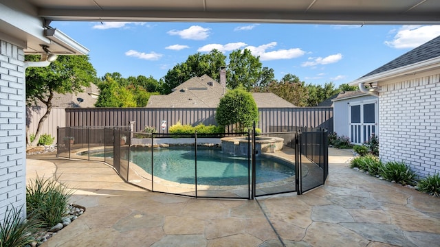 view of pool featuring an in ground hot tub and a patio area